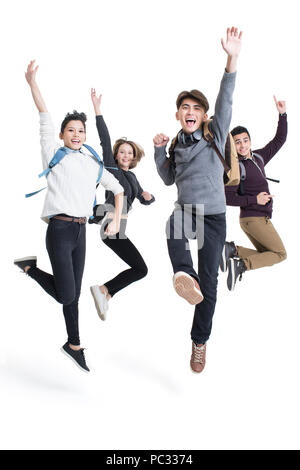 Allegro all'estero studenti jumping Foto Stock