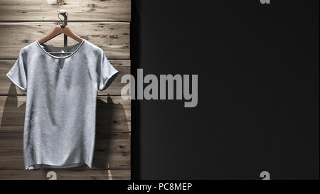 Mock-up t-shirt su legno scuro dello sfondo Foto Stock