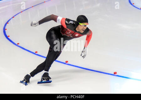 Gilmore Junio (CAN) concorrenti del pattinaggio di velocità - Mens' 500m a i Giochi Olimpici Invernali PyeongChang 2018 Foto Stock