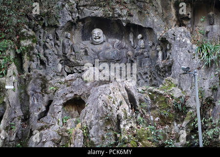 La scultura di ridere Buddha. Si è creduto che toccando lo stomaco scultura porta fortuna e felicità. Foto Stock