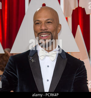 HOLLYWOOD, CA - febbraio 22: Comune arriva a 87th annuale di Academy Awards di Hollywood & Highland Center il 22 febbraio 2015 in Hollywood, la California. Persone: comune Foto Stock
