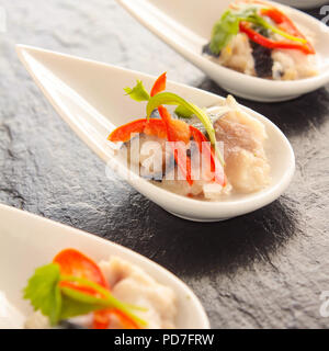 Indurito crostini di pesce Foto Stock