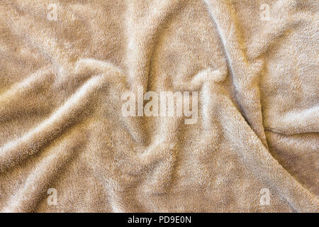 Crumpled splendenti texture materiale tessuto. pattern tessili come sfondo. Foto Stock