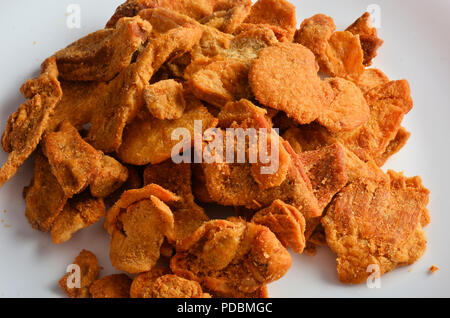 Cotenna di maiale cibo preferito in piemonte italia, isolata su bianco nel ristorante. Foto Stock