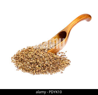 Semi di finocchio sul cucchiaio di legno vicino. Foto Stock