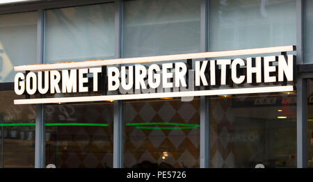 Gourmet Burger Kitchen sign logo. Foto Stock