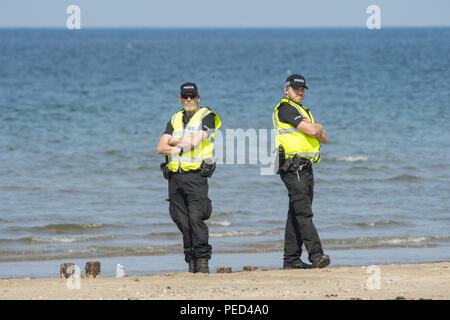 I dimostranti si riuniscono come rampe di sicurezza come presidente Donald Trump e figlio Eric Trump giocare a golf presso il Turnberry corso come egli visita la Scozia per la prima volta nella sua presidenza con: atmosfera dove: Turnberry, Regno Unito quando: 14 lug 2018 Credit: Euan ciliegio/WENN Foto Stock