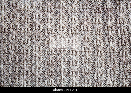 Maglione, tessitura a maglia modello di lana, sfondo beige Foto Stock