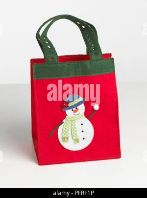 Pupazzo di neve sul bambino Natale shopping bag Foto Stock
