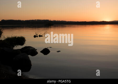 Tramonto su Loch di Skene Foto Stock