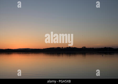 Tramonto su Loch di Skene Foto Stock