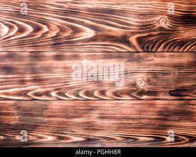 Sfondo in legno di pino di legno bruciato pennello texture astratta anelli annuali luoghi nodi pannelli prefabbricati per il rivestimento di pavimenti in parquet laminato pictu Foto Stock