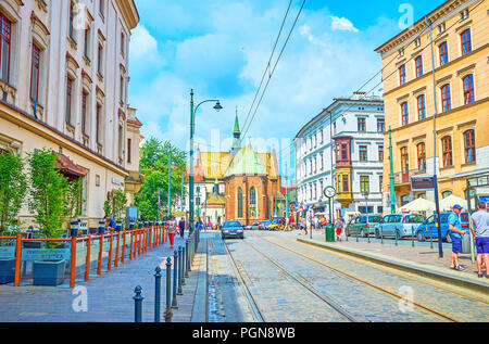 Cracovia in Polonia - Giugno 11, 2018: La scena urbana della parte centrale di Cracovia con la Chiesa di San Francesco di Assisi sullo sfondo, il 11 giugno a Cracovia Foto Stock