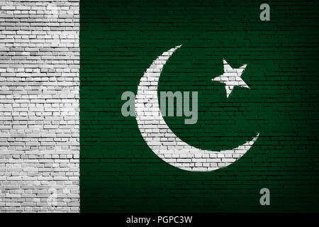 Bandiera nazionale del Pakistan su un sfondo mattone Foto Stock