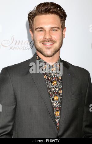 Grigio Damon presso gli arrivi per la trentatreesima annuale di Imagen Awards, JW Marriott Los Angeles a LA LIVE, Los Angeles, CA 25 agosto 2018. Foto di: Priscilla concedere/Everett Collection Foto Stock