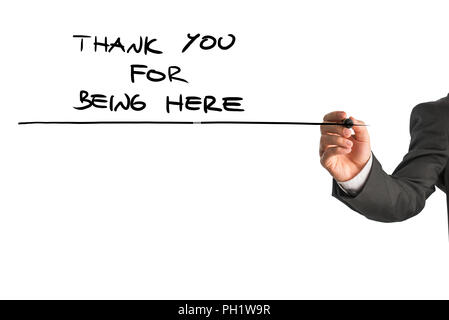Vista dettagliata del maschio di scrittura a mano un grazie per essere qui nota su un bianco schermo virtuale. Concettuale della cura e del sostegno per chi è nel bisogno. Foto Stock