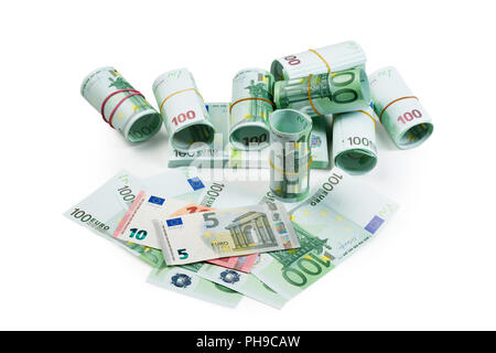 Le banconote in euro in pile e rotoli Foto Stock