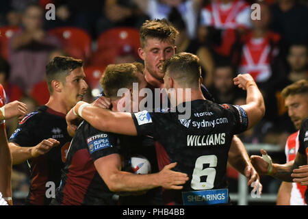 St Helens, Regno Unito. Il 31 agosto 2018. Totalmente Wicked Stadium, St Helens, Inghilterra; Betfred Super League Super 8's , St Helens v Wigan Warriors ; Dan Sarginson di Wigan Warriors celebra la sua seconda prova a credito: News immagini /Alamy Live News Foto Stock