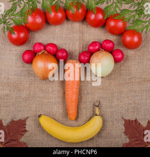 Faccia vegetale fotografato su un tessuto in iuta un mercato ortofrutticolo Foto Stock