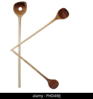 Cucchiai di legno come K Foto Stock