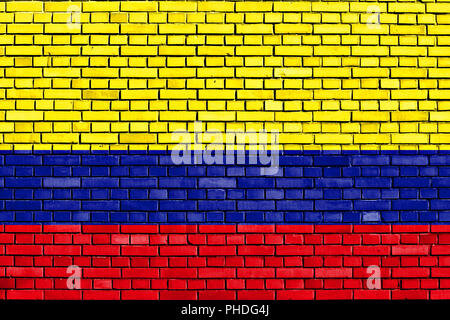 Bandiera della Colombia dipinta su un muro di mattoni Foto Stock