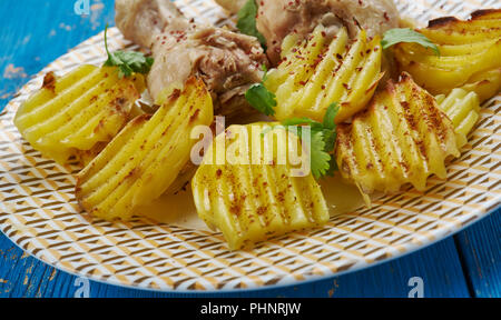 Soffocato le cosce di pollo Foto Stock