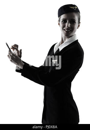 Una hostess caucasica equipaggio di cabina donna al telefono isolato su sfondo bianco in silhouette Foto Stock