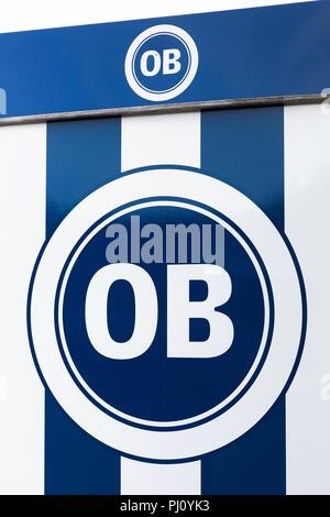 Odense, Danimarca - Agosto 16, 2018: Odense boldklub logo su una parete. Odense boldklub è un professionista danese di calcio di club con sede nella città di Odense Foto Stock