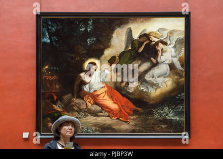 Visitatore davanti al dipinto "Cristo sul Giardino degli Ulivi" dal romantico francese pittore Eugène Delacroix (1824) visualizzato a sua retrospettiva nel museo del Louvre a Parigi, Francia. La mostra che presenta i capolavori del leader del Romanticismo francese corre fino al 23 luglio 2018. Foto Stock