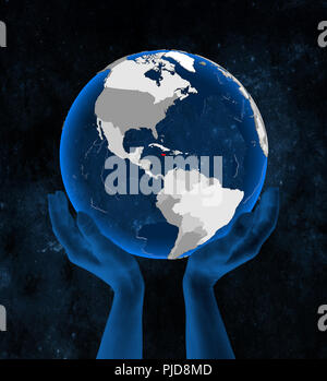 La Giamaica il blu traslucido globe tenutosi a mani nello spazio. 3D'illustrazione. Foto Stock