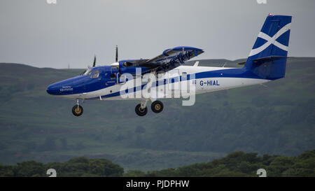 Logan aria twin otter aeromobile visto su approccio finale all'Aeroporto Internazionale di Glasgow, Renfrewshire, Scozia. Foto Stock