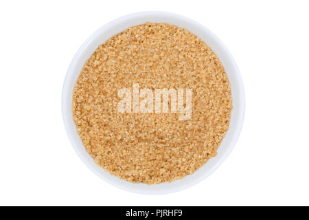 Brown zucchero di canna di cui sopra recipiente isolato su uno sfondo bianco Foto Stock