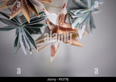 Fiori origami banconote Foto Stock