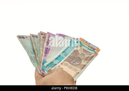 Rupie indiane in mano. Indian più nota di valuta tenuto in mano. Foto Stock
