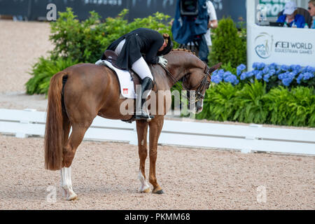 Tryon, Stati Uniti d'America. Xiii Sep, 2018. Equestre, FEI World Equestrian Game 2018, Grand Prix de Dressage: Isabell Werth tifo mentre sul suo cavallo bella rosa. Credito: Stefan Lafrentz/dpa/Alamy Live News Foto Stock