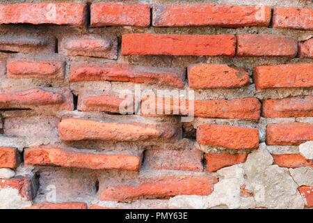 Pietra di parete di mattoni arcaici di texture colorato disegno bello per lo sfondo Foto Stock