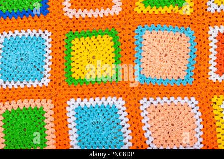 Un crochet fatti a mano coperta di lana sfondo. Foto Stock