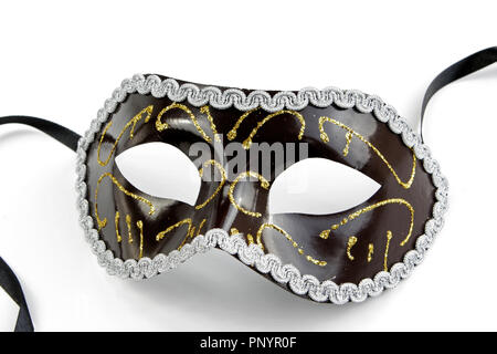 Vista ravvicinata di nero maschera veneziana con glitter Oro e Bianco Pizzo. Foto Stock