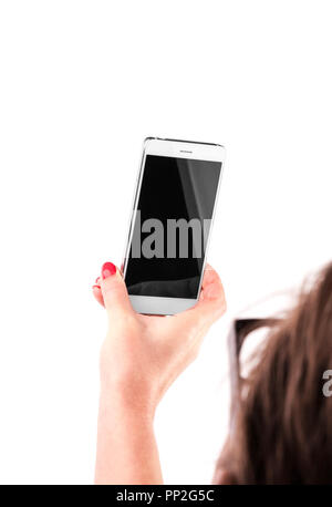 Femmina tenuta a mano e toccando un Mobile Smartphone Foto Stock