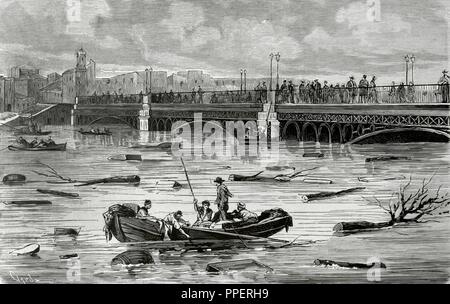 Historia de España. Andalusia. Inundaciones en la ciudad de Sevilla. Puente de Triana en la tarde del 8 del valore effettivo. Desbordamiento del río Guadalquivir. Grabado por Capuz. La Ilustración Española y Americana, 22 de diciembre de 1876. Biblioteca Histórico Militar de Barcelona. Cataluña, España. Foto Stock