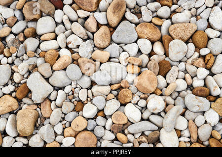 Riverbed ciottoli, tono caldo immagine di sfondo. Foto Stock