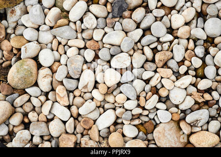 Riverbed ciottoli, tono caldo immagine di sfondo. Foto Stock