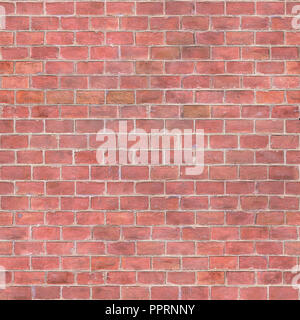 Un frammento di un antico muro di pietra fatta di mattoni rossi. Immagine di sfondo. Foto Stock