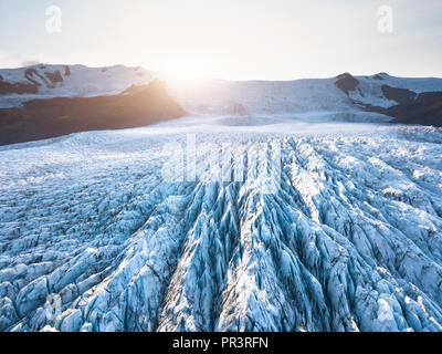 Glacier surface details viewed from above with crevasses and seracs, drone aerial view of Vatnajökull in Iceland, largest icelandic ice cap, beautiful Foto Stock