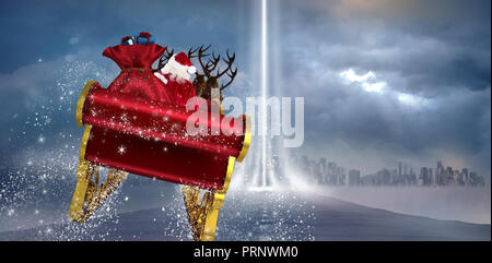 Immagine composita di santa battenti la sua slitta Foto Stock
