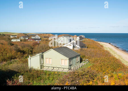 Case sulla spiaggia vicino a bassa Newton-By-The-Sea in Embleton Bay, Northumberland, England, Regno Unito Foto Stock