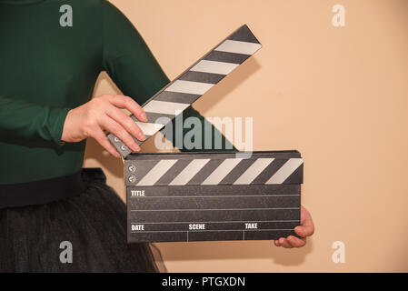 Clapboard in mano Foto Stock