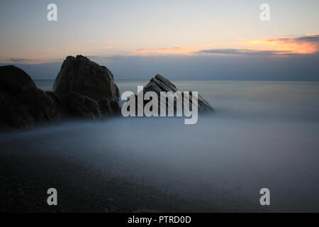 Quando mi è stato sempre questo colpo, ero swaggering nell'acqua di mare con la mia fotocamera. mentre le mie scarpe è stata socked. Foto Stock