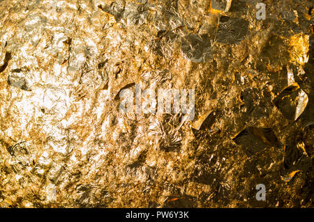 Foglia oro incollata su object, background e texture Foto Stock