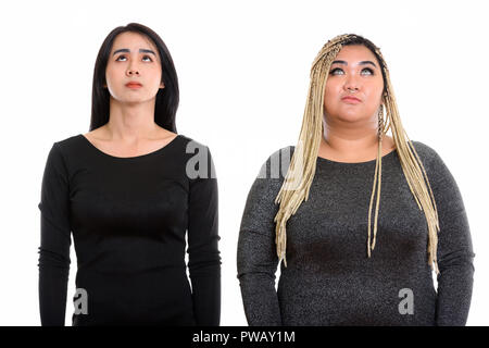 Giovani asiatici transgender donna e grasso donna asiatica il pensiero e l Foto Stock